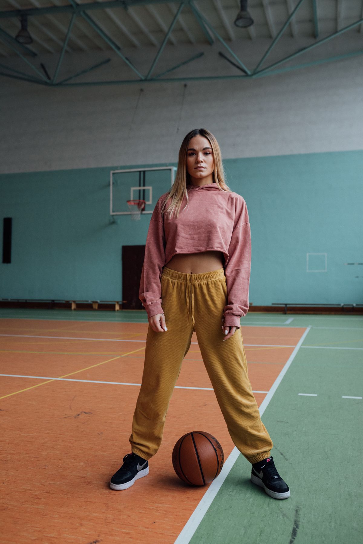Athlete in warm-up gear, studio light